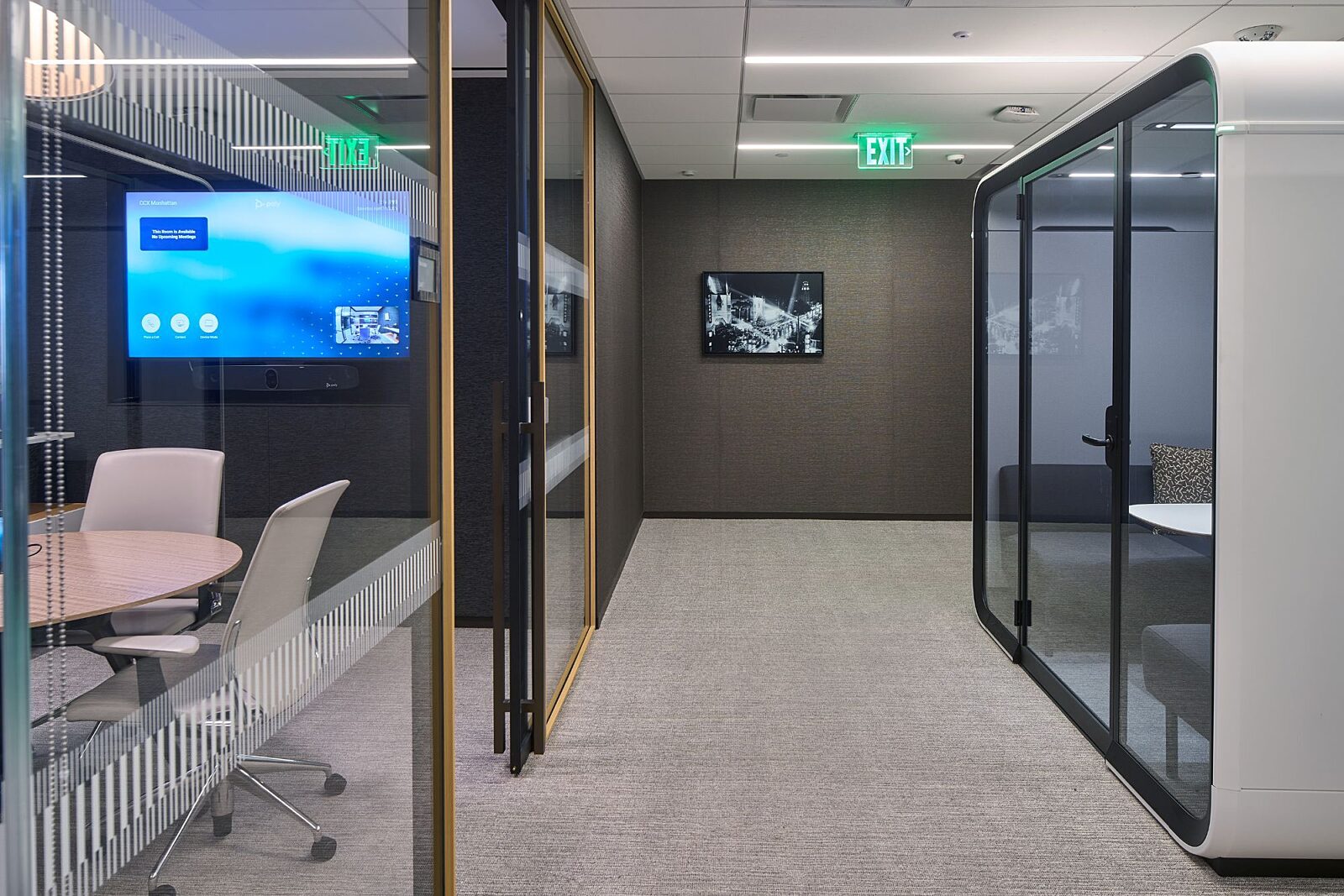 Glass-enclosed meeting rooms in the Paul Hastings Century City office.