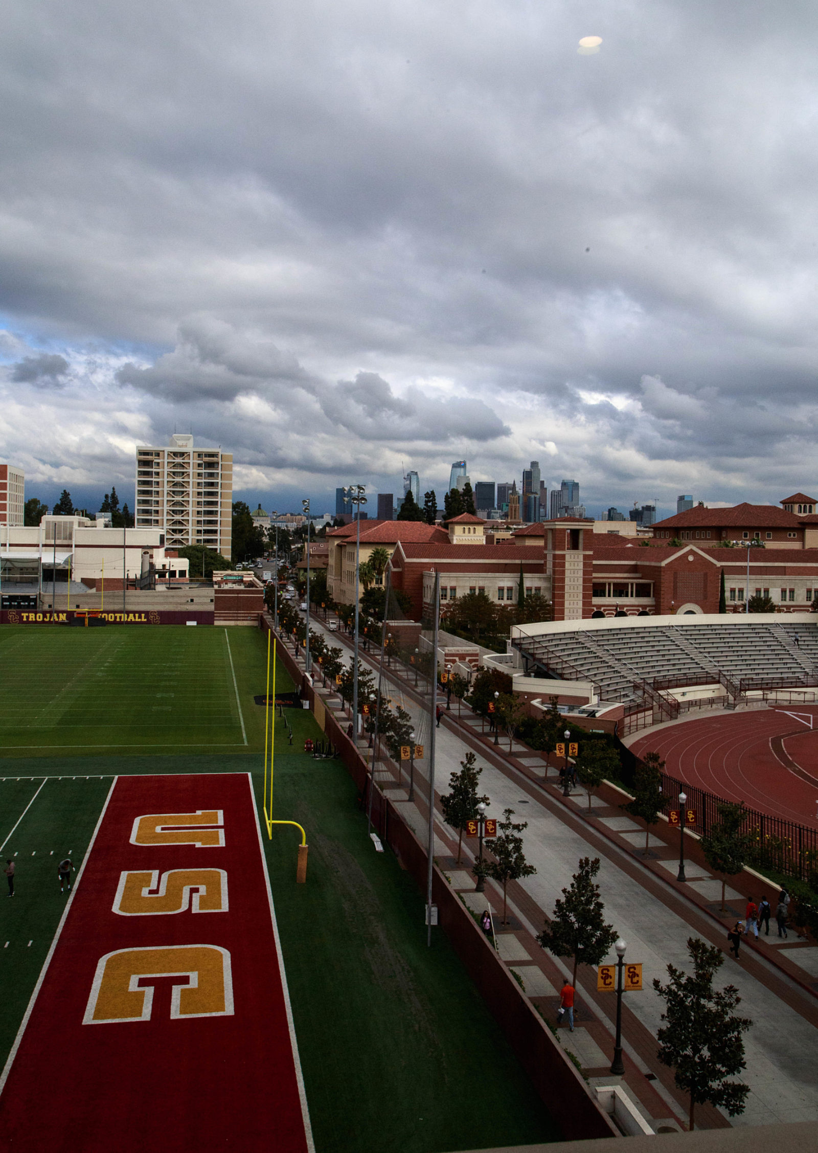 The USC school football court is an outdoor sports facility with a green field, bleachers for spectators.