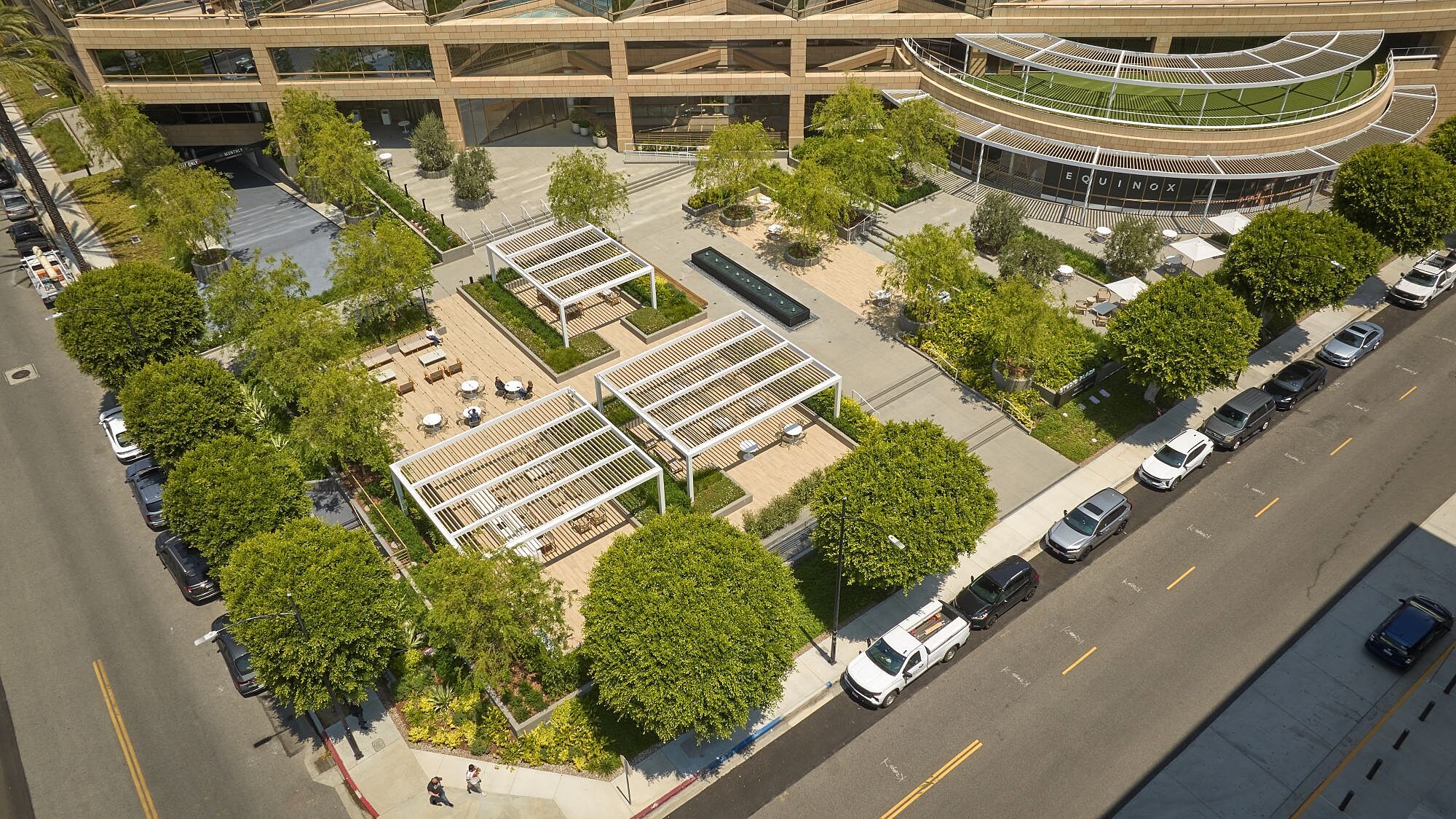 Drone shot of outdoor amenity space with modern furniture at Studio Plaza.