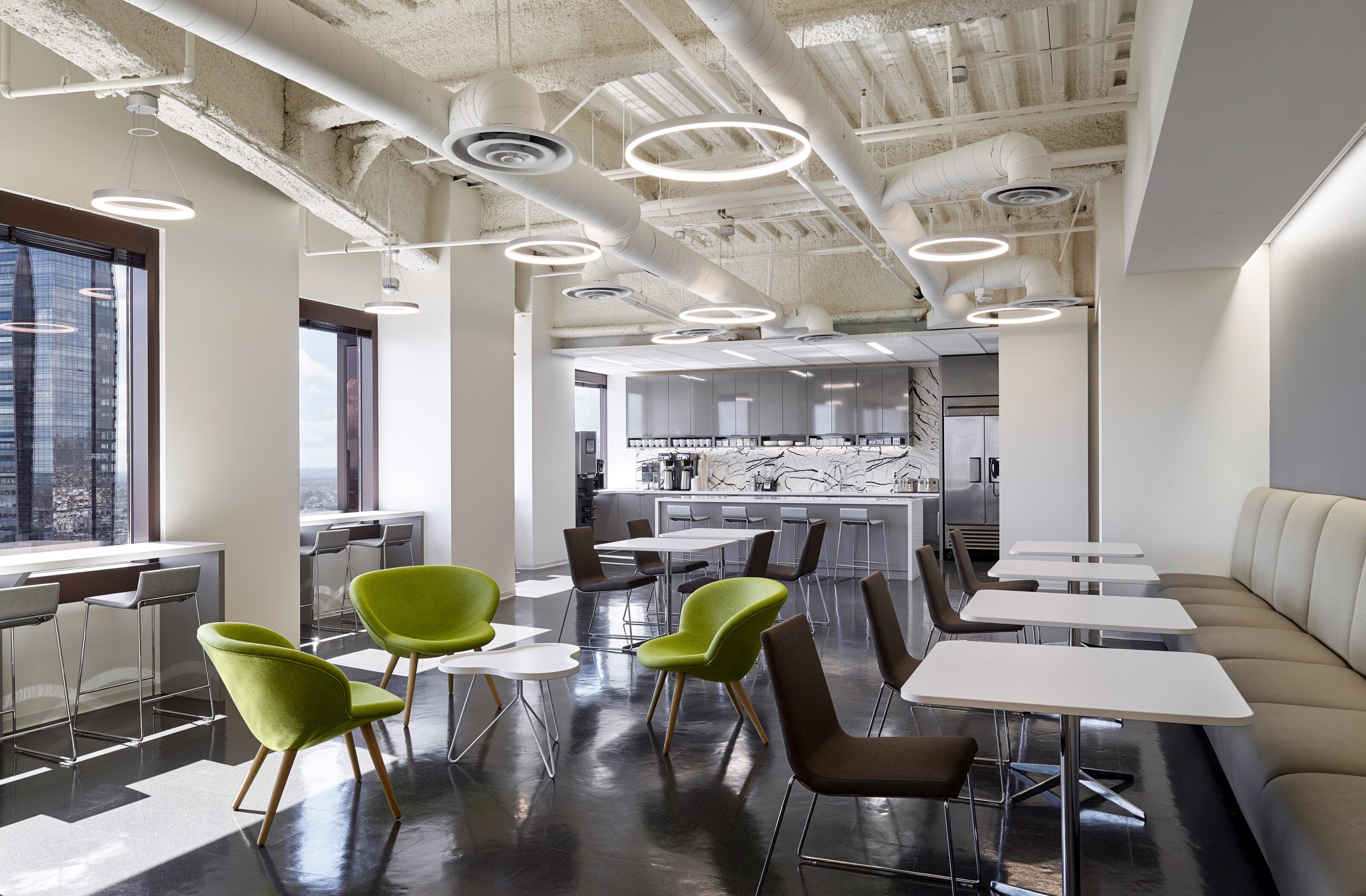 A empty cafeteria with multiple type of seating.