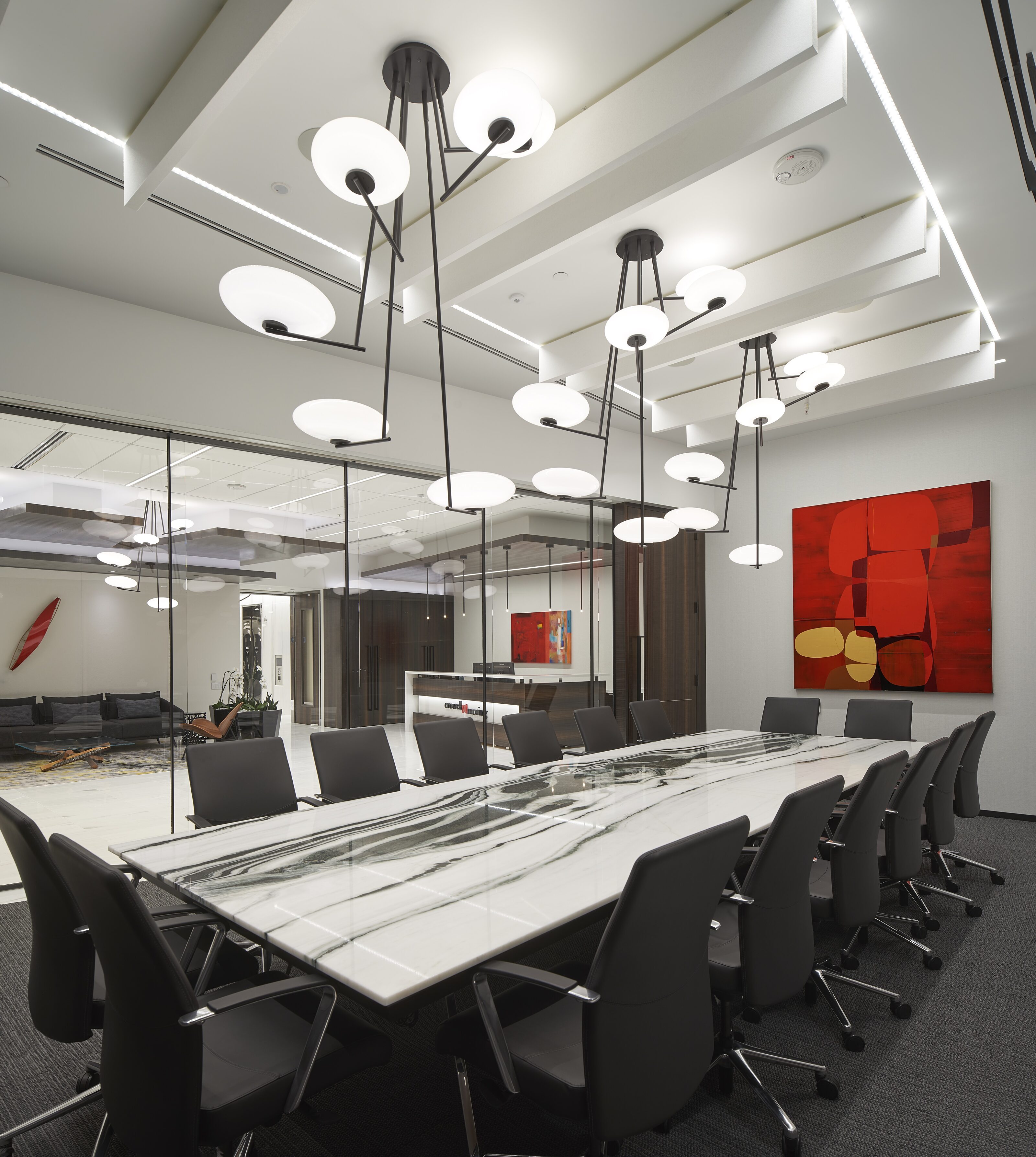 A modern style conference room with marble desk in the center.