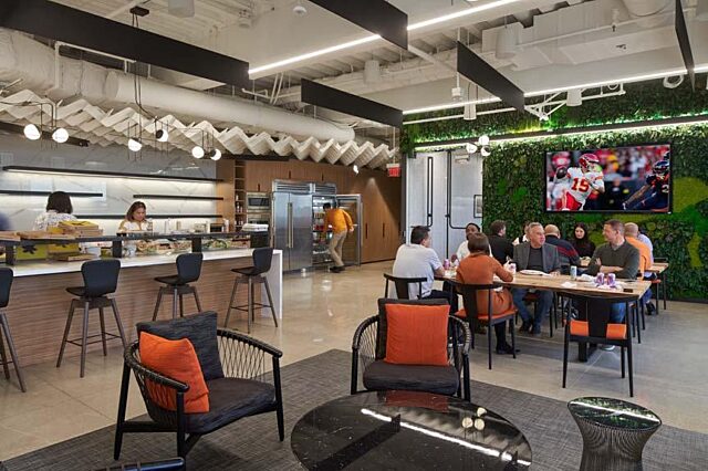 A break room with a kitchen and seating areas.