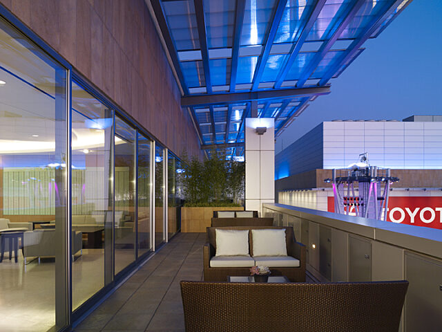 An inviting outdoor seating area adorned with white lounge chairs, providing a delightful space for socializing and unwinding.